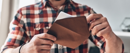 Man opening letter