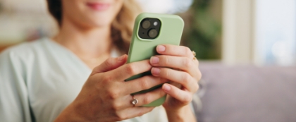 Woman looking at green phone